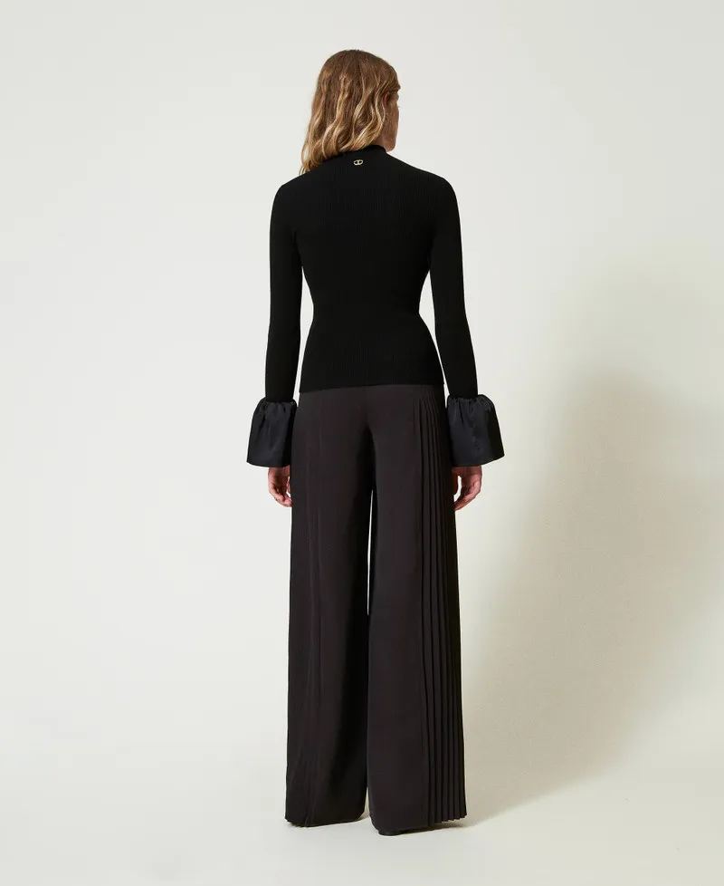 Pantaloni a palazzo in georgette plissé